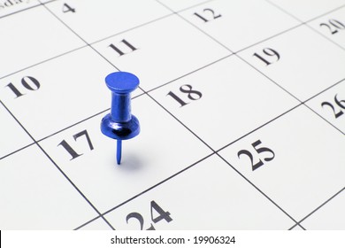 Blue Thumb Tack On Calendar