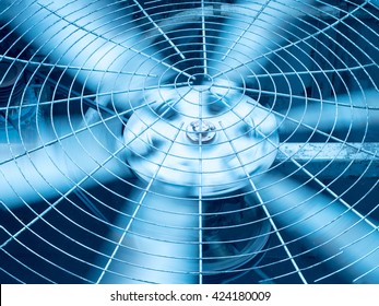 Blue Tone Of HVAC (Heating, Ventilation And Air Conditioning) Spinning Blades. Industrial Ventilation Fan Background.