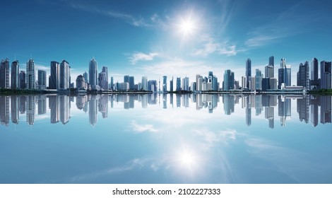 Blue tone panorama of waterfront city skyline with reflection. Image composite. - Shutterstock ID 2102227333