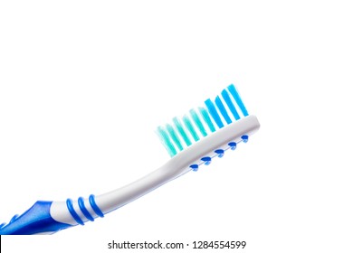blue toothbrush on an isolated background, close up