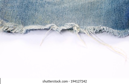Blue torn jeans texture with white background  for text