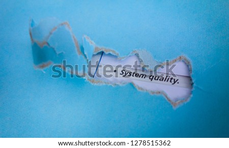 Blue torn paper with text system quality