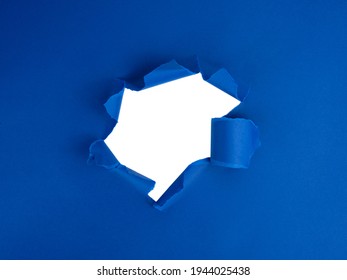 Blue torn sheet of paper with whole space for text