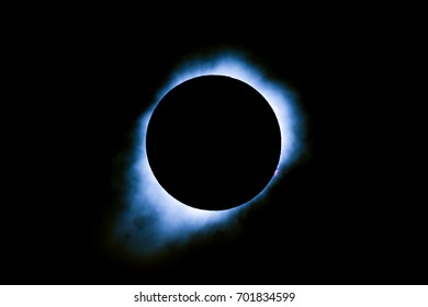 Blue Total Solar Eclipse with Clouds