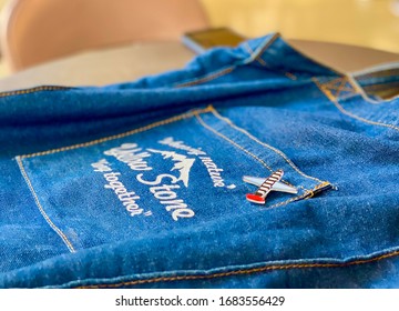 A Blue Tote Bag On The Desk With Sunlight