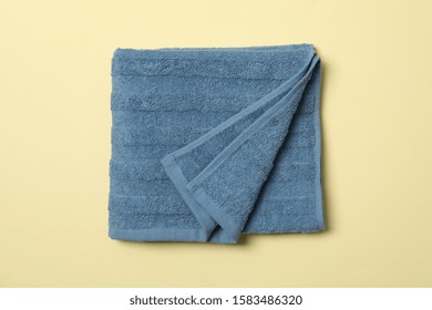 Blue Towel On Beige Background, Top View And Close Up