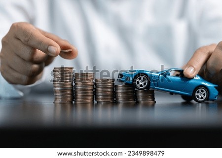 Blue Toy Car In Front Of Businessman Calculating Loan. Saving money for car concept, trade car for cash concept, finance concept.
