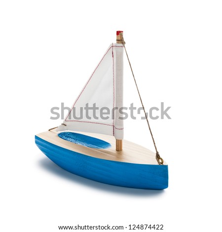 Blue toy sailboat, isolated on white.