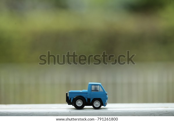 Blue toy truck on the\
wall
