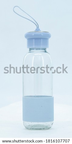 Blue transparent bottle with rubber grip. 