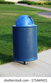 Blue Trash Can In Park