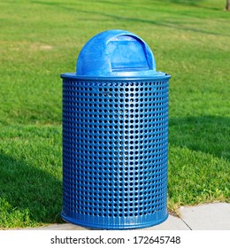 Blue Trash Can In Park 