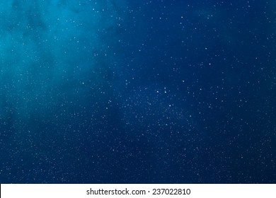 Blue Under Water World. Cyan blue and dark marine blue. Ink spilled in water. Light coming from top corner creating circular gradient and visual depth. - Shutterstock ID 237022810