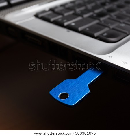 Blue usb key inside laptop 