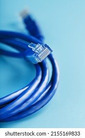 Blue UTP Internet Cable - Isolated On A Blue Background Ethernet Cord