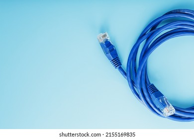 Blue UTP Internet Cable - Isolated On A Blue Background Ethernet Cord