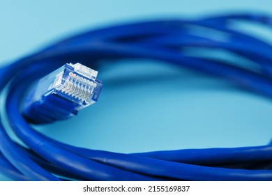 Blue UTP Internet Cable - Isolated On A Blue Background Ethernet Cord