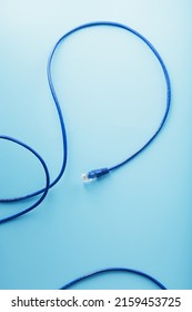 Blue UTP Internet Cable - Isolated On A Blue Background Ethernet Cord