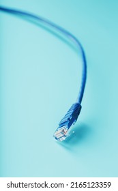 Blue UTP Internet Cable - Isolated On A Blue Background Ethernet Cord