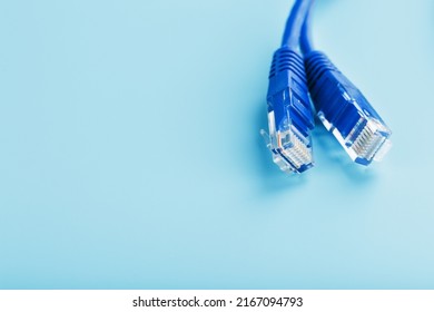 Blue UTP Internet Cable - Isolated On A Blue Background Ethernet Cord