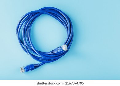 Blue UTP Internet Cable - Isolated On A Blue Background Ethernet Cord