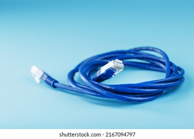 Blue UTP Internet Cable - Isolated On A Blue Background Ethernet Cord