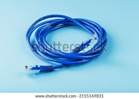 Blue UTP Internet Cable - Isolated on a blue background Ethernet Cord