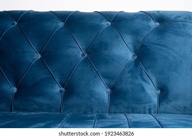 Blue Velvet Couch Background Texture With Sunken Buttons, Close Up Velvet Sofa Texture.