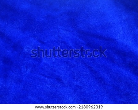 Blue velvet fabric texture used as background. Empty light blue fabric background of soft and smooth textile material. There is space for text.	