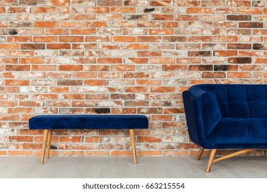 Blue Velvet Furniture Set On A Brick Wall