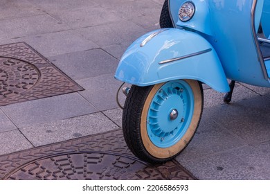 A Blue Vintage Motorcycle Front Wheel