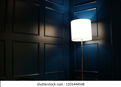 A blue wainscoting cafe with a floor lamp