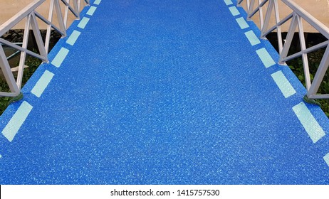 Blue Walking Way In Front Of The Pier,A Boat Walkway Painted To Prevent Slippery Of Passengers