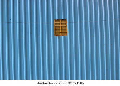 Blue wall with a small window
