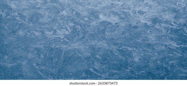 A blue wall with a textured surface. rough texture as an abstract texture background for template pages and banners