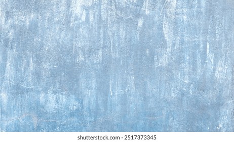 A blue wall with white paint peeling off. The wall is covered in blue paint and has a rough texture - Powered by Shutterstock