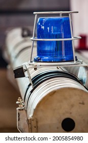 Blue Warning Light On Fire Truck. Car-building Plant Workshop. Blurred Background.