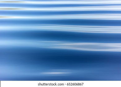 Blue Water Background With Ripples Sea Low Angle View, River, Wave. Close Up Nature Background. Soft Focus With Selective Focus