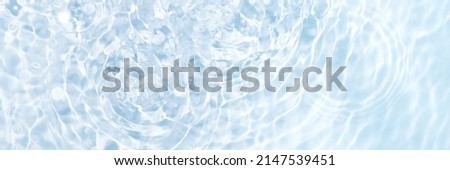 Blue water banner, clean and transparent surface with circles from drops, flat lay