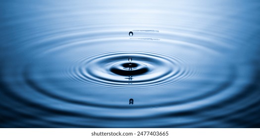 Blue Water drop falling, macro splash. Natural background. - Powered by Shutterstock