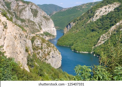 blue water of Koman-Fierza Lake between steep cliffs, Albania