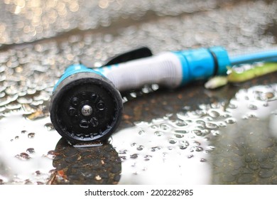 The Blue Water Nozzle Lay On The Watery Floor.