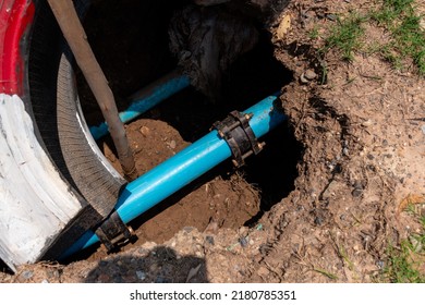 Blue Water Pipe Buried Under The Ground