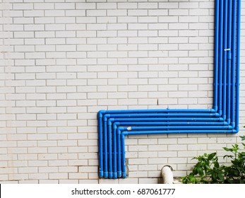 Blue Water Pipe On The White Wall