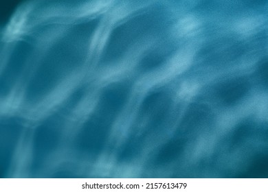 Blue Water Ripples Background -  Underwater Texture. Sun Shining Through Water.