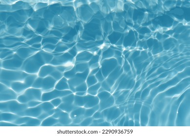 Blue water with ripples on the surface. Defocus blurred transparent blue colored clear calm water surface texture with splashes and bubbles. Water waves with shining pattern texture background. - Shutterstock ID 2290936759
