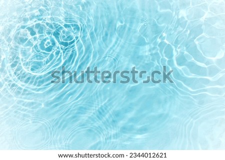 Blue water with ripples on the surface. Defocus blurred transparent blue colored clear calm water surface texture with splashes and bubbles. Water waves with shining pattern texture background. Foto stock © 