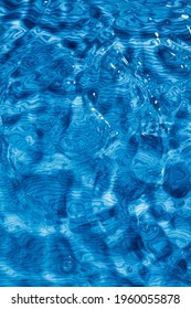 Blue Water Ripples And Splashes. Boiling Blue Water Texture With Lines.	