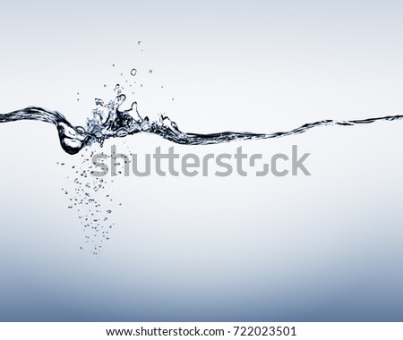 Blue water splash, water drops and bubbles depth gradient