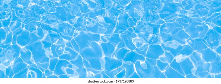 blue water surface in the swimming pool, water in the pool . horizontal background for summer concept.